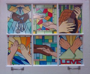 "A Window Into Hospice," by Tammy Hromadka. Six panels set in an old window frame, each showing the hands of a caregiver.